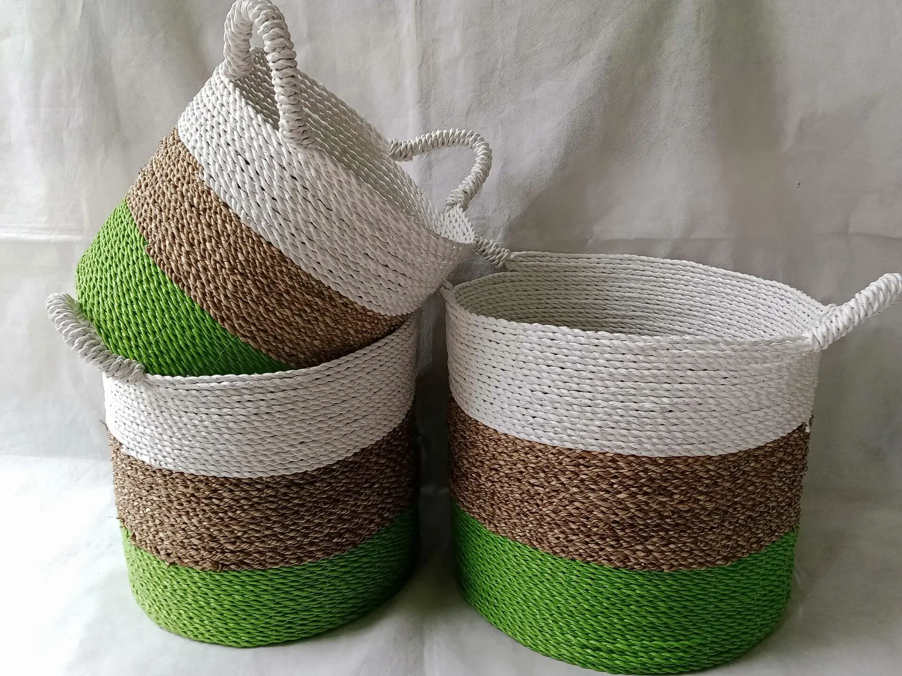 Woven baskets with natural and green accents from the BAF product gallery